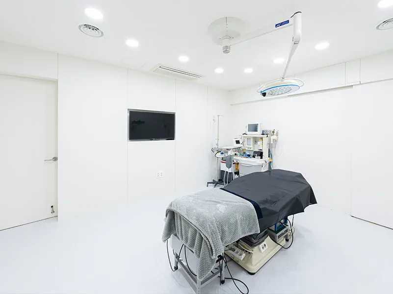 Procedure room with a treatment table and monitoring equipment
