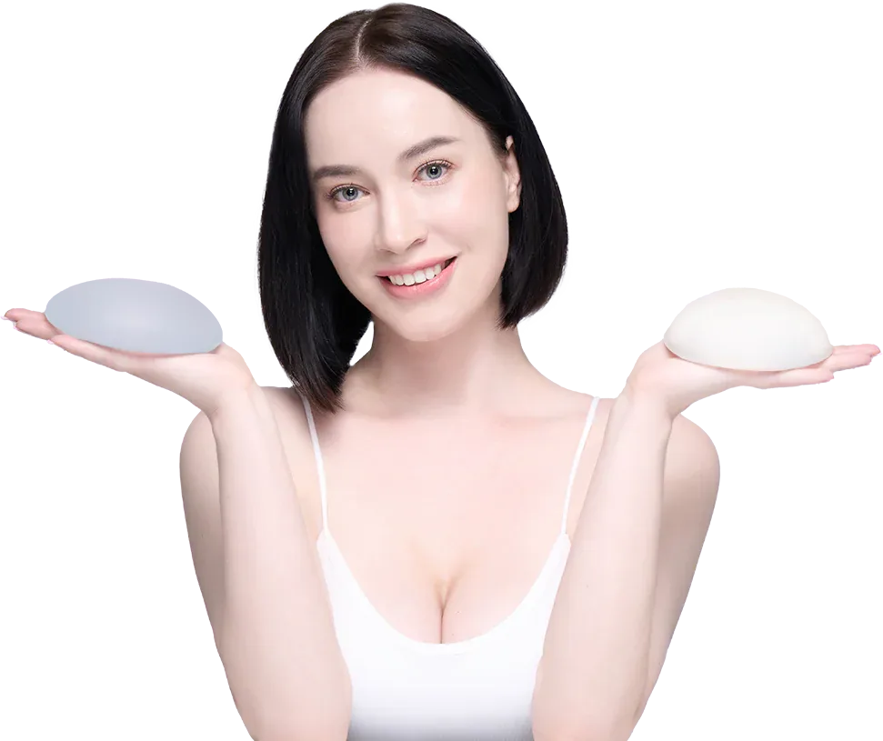 Model holding a breast implant sample in each hand