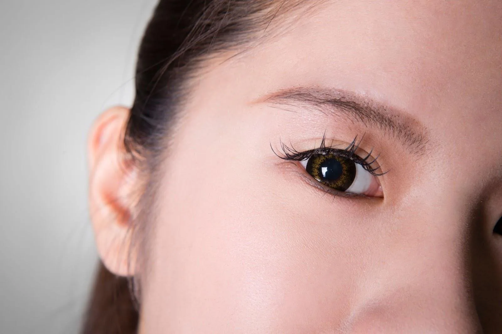Side-angle close-up of an eye and eyelid