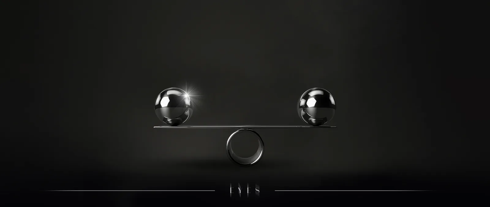 Two metal spheres balanced on a bar against a dark background