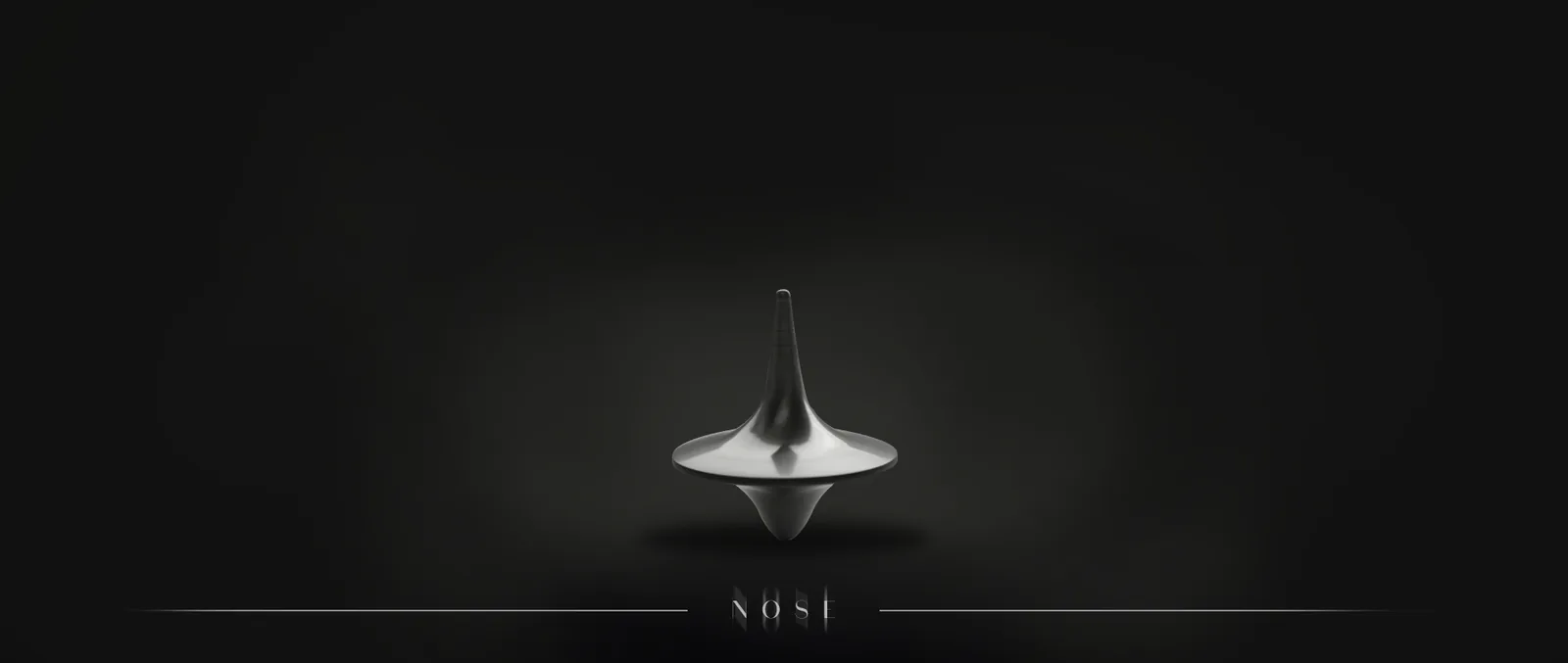 Silver spinning top on a dark background
